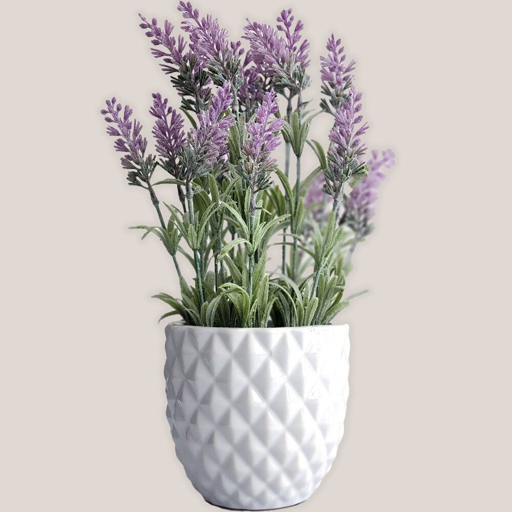 Decorative Artificial Plant with Lavender Flowers in a White Ceramic Vase